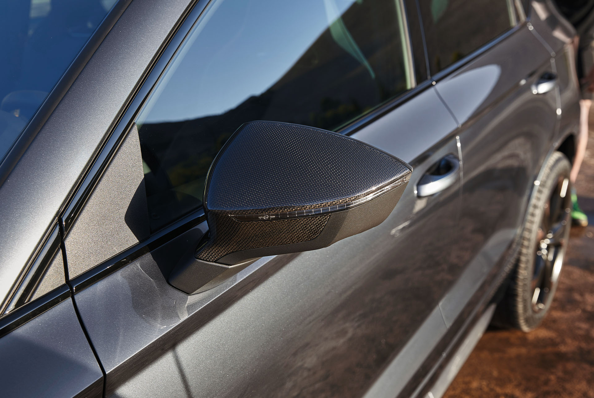 Close-up of the CUPRA Ateca's copper carbon fibre mirror cases, adding a premium and refined touch to the design.